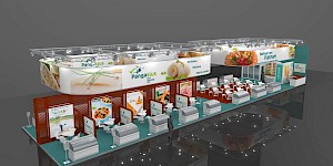 CAD-Visualisierung: Aufsicht auf einen großen, langgestreckten Messestand für Pangasius, Seafood aus Vietnam, in Weiß mit türkisfarbenem Boden. Zwei ovale Leuchtkörper mit Fotos von Fisch- und Garnelengerichten sowie den Schriftzügen Pangasius und „Seafood from Vietnam" schweben unter Traversen mit Scheinwerfern über dem Stand. Entlang einer rotbraunen Wand mit beleuchteten Produkttafeln reihen sich weiße Kühltheken; dazwischen liegen Sitzgruppen mit weißen Tischen und Stühlen. Eine graue Personenfigur dient als Maßstab. CAD-Visualisierung erstellt von Torsten Kraus.